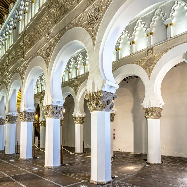 White arches at Ancient Sinagoga de Santa Maria La Blanca, Synagogue in the historical center of Toledo, Spain. Erected in 1180 and is considered the oldest synagogue building in Europe still standing.