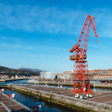 Bilbao, Spain - February 13, 2022: View of Carola Crane. It is a crane that was once used in shipbuilding at the Astilleros Euskalduna shipyard, now is part of Maritime Museum.