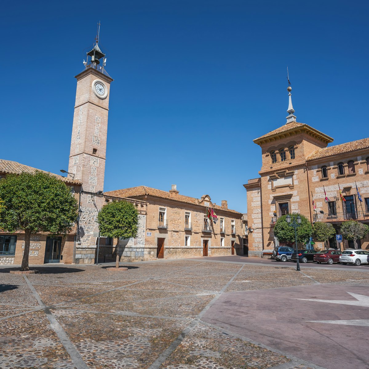 Plaza de Espana Square with Clock Tower (Torre del Reloj) and Consuegra City Hall - Consuegra, Castilla-La Mancha, Spain.