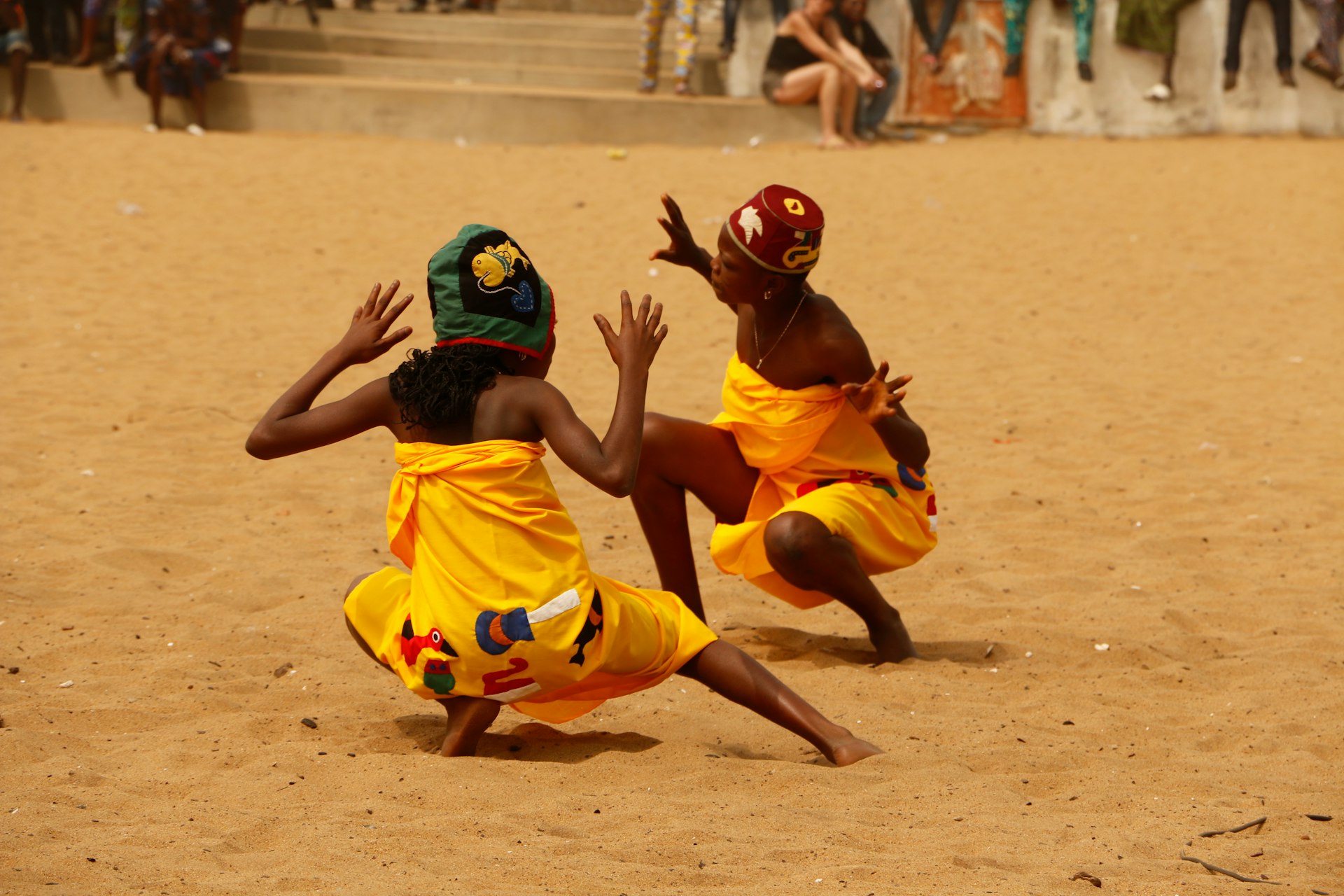 children are singing and dancing at the voodoo festival at the beach in Ouidah, Benin