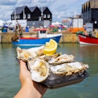 Whitstable / UK - July 22 2017: Oysters from the harbour in a seaside town on the north east coast of Kent, south England; Shutterstock ID 1732577420; your: -; gl: -; netsuite: -; full: -
1732577420