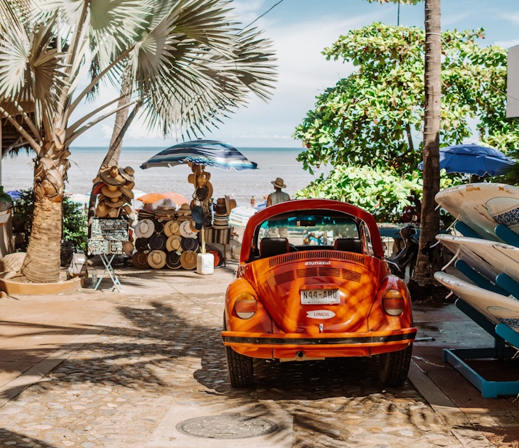 Sayulita, Mexico - September 16, 2021 - street photography of red VW Beetle vocho, a hat shop, and surfboards on Sayulita Beach; Shutterstock ID 2045735411; your: -; gl: -; netsuite: -; full: -
2045735411