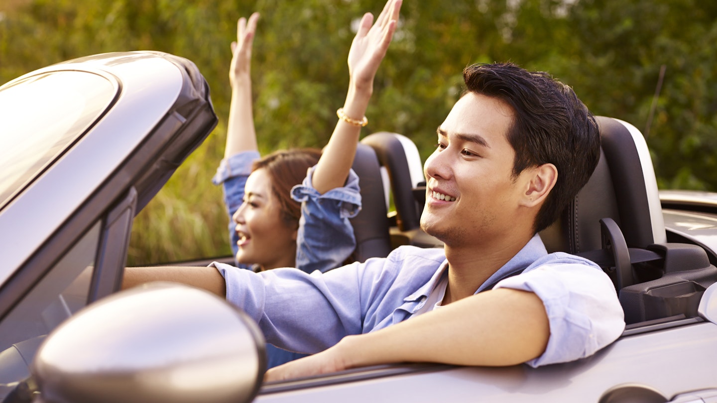 young asian couple riding in a convertible sport car at sunset.; Shutterstock ID 622422614; your: Jennifer Carey; gl: 65050; netsuite: Online Editorial; full: Singapore road trips
622422614
Young East Asian couple riding in a convertible sports car at sunset.