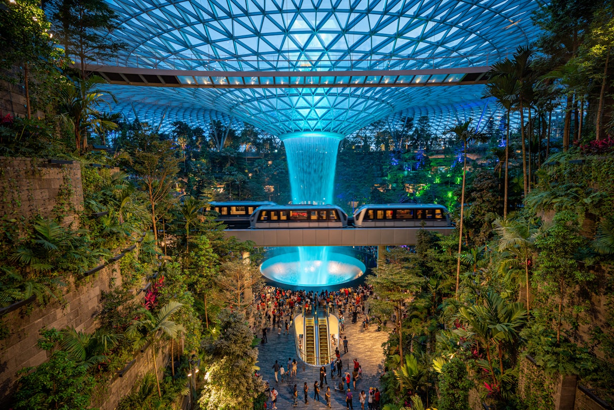 MAY 19, 2019: The Rain Vortex inside the Jewel Changi Airport at night.
1402131020
airport, architecture, asia, attraction, avatar, building, changi, concept, day, design, development, facility, forest, fountain of wealth, garden, giant, green, greenhouse, indoor, inside, jewel, landmark, landscape, largest, laser, leisure, light, made, mall, mega, modern, nature, night, park, people, plant, rain, shopping, show, showing, singapore, tallest, terminal, tourism, travel, tree, urban, vortex, waterfall, world