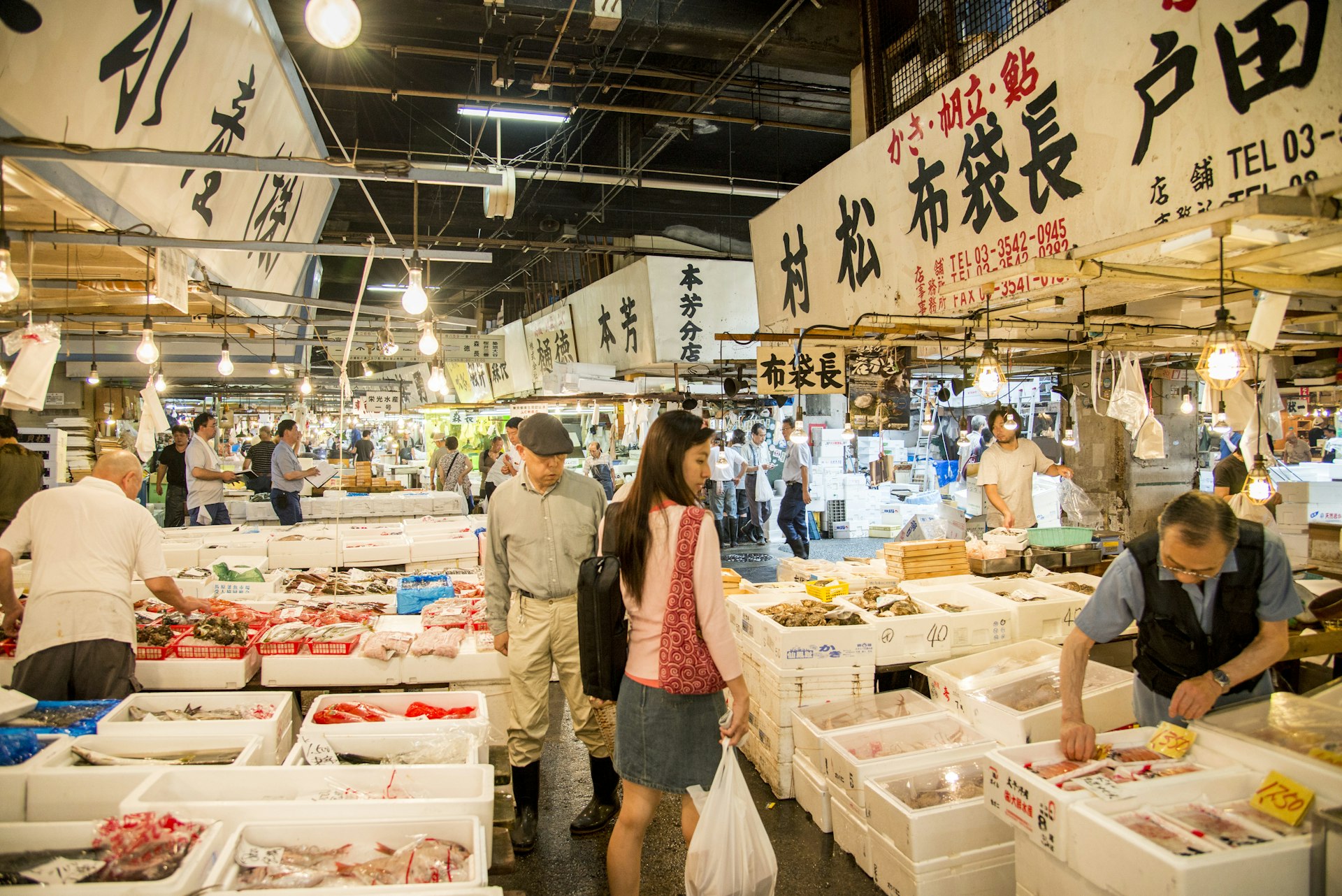 Merchants selling seafood in the famous Tsukiji fish market, Tokyo