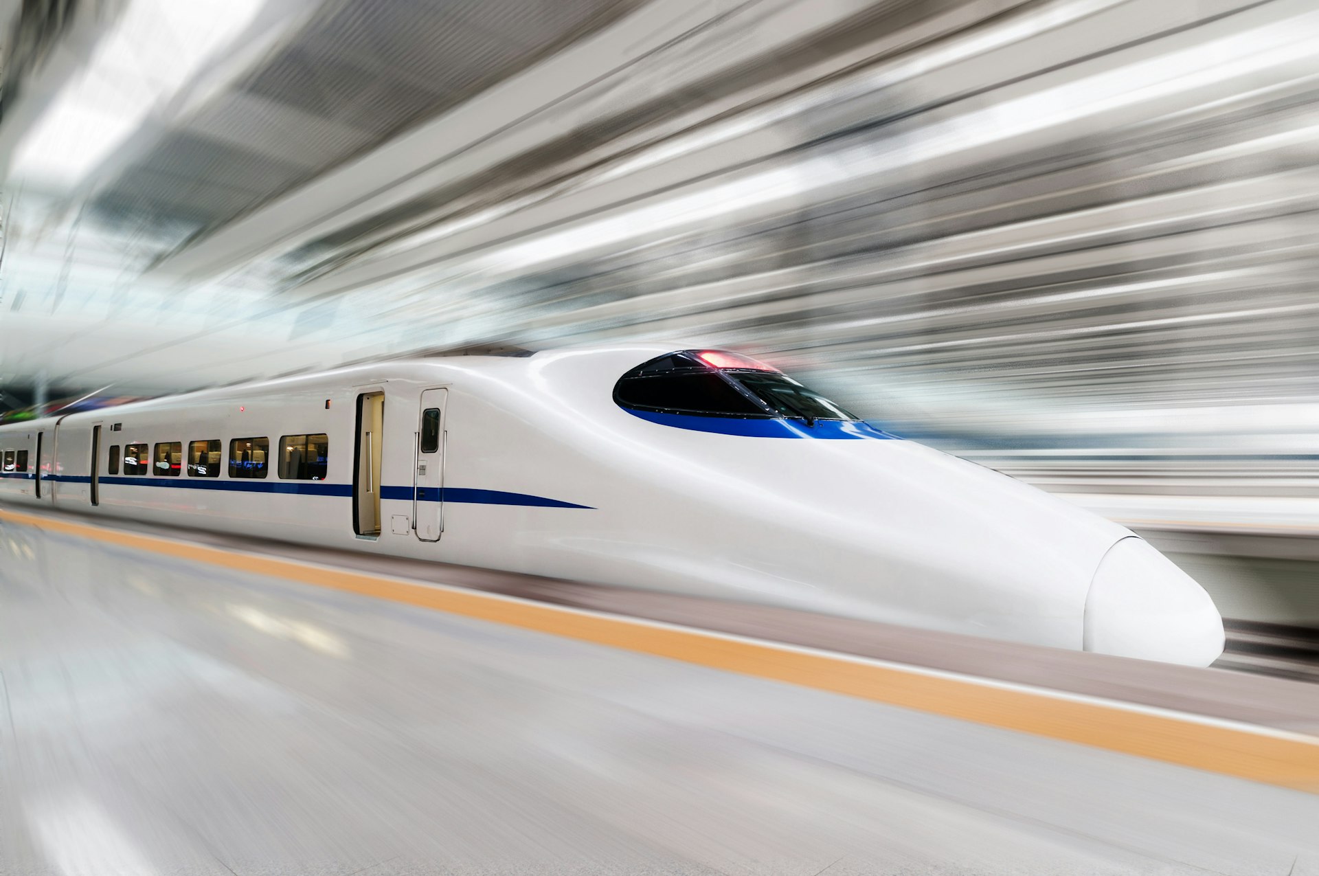 White, high speed bullet train with motion blur