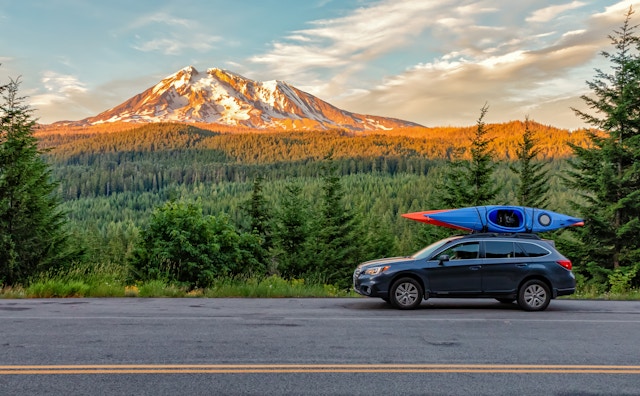 Gifford Pinchot National Forest, Washington - July 13, 2018:  SUV with Kayaks in front of Mt. Adams at sunset
1198502450