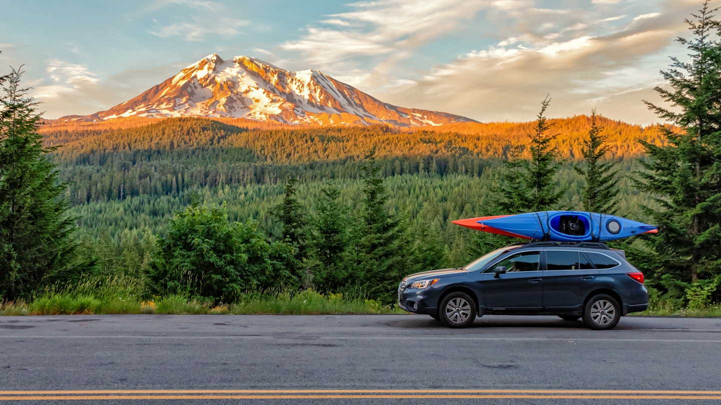 Gifford Pinchot National Forest, Washington - July 13, 2018:  SUV with Kayaks in front of Mt. Adams at sunset
1198502450