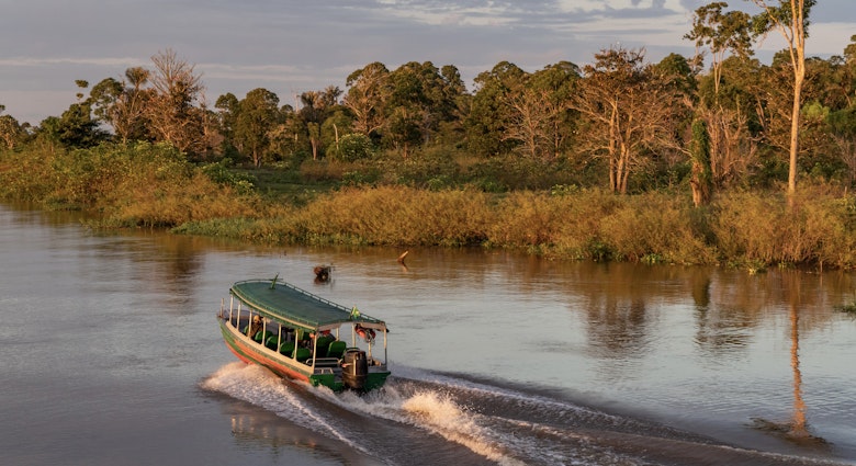 At first light in the early morning, an express passenger boat that services between Manaus and Careiro da Varzea, on the banks across the meeting of the two rivers - Negro and Amazon - heads with only one passenger along the flooded banks of the Amazon´s varzea. This is the only means of transport, as no bridges span across the Amazon river, though quite a few small cities lie along its banks. It is at least twice as fast as the ferry, which will take over an hour to do the same journey.
1005667338
am, amazonas, br-319, k-1 ii, upper amazon, upper amazon river, varzea, calm water, cloudy, early morning, ferry crossing, floodlands, jungle, nature scene, passenger transport, regional transport, speed boat, sunrise, transport, trees