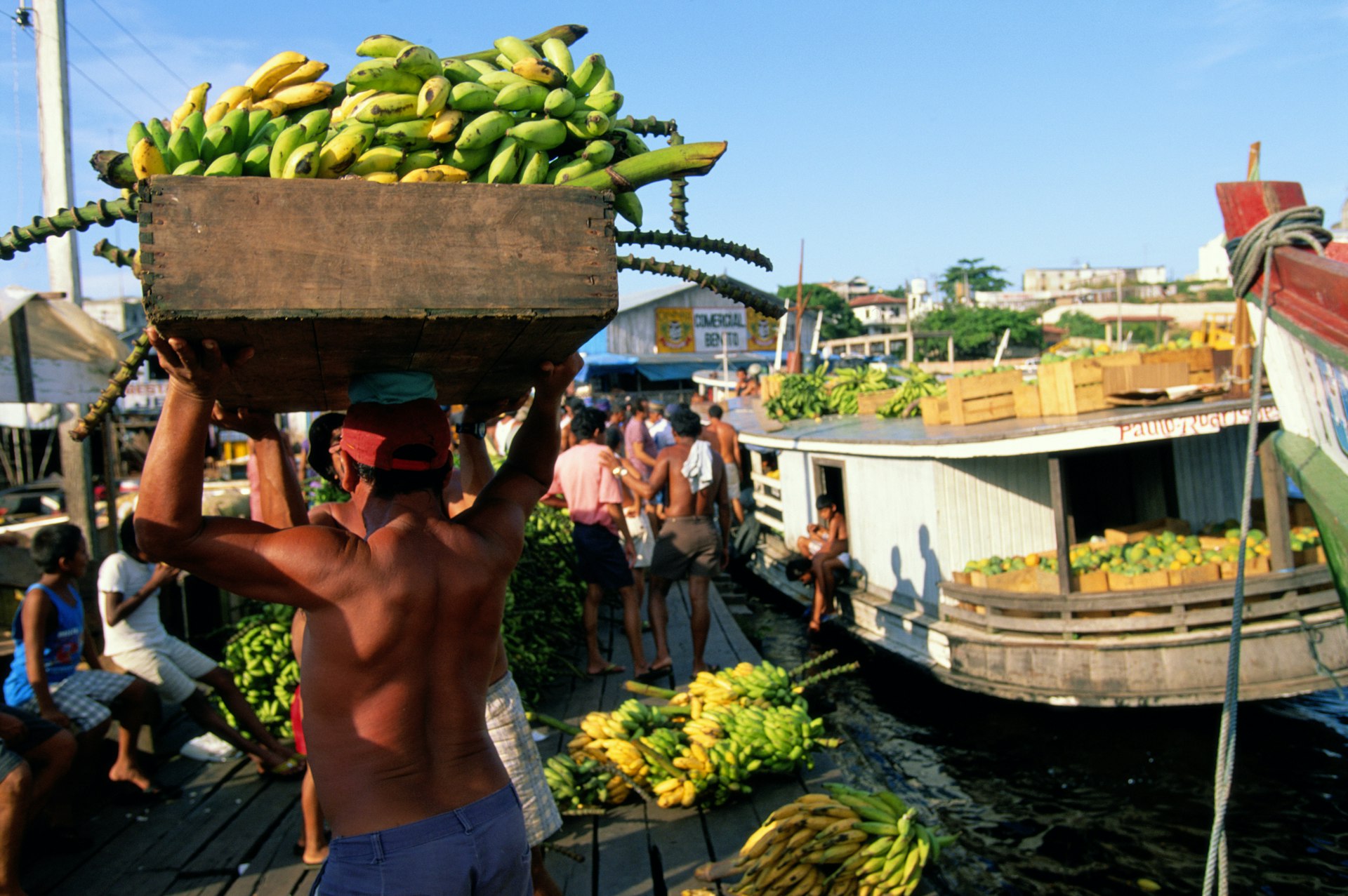 People load bananas into boats in Manaus, Amazonas, Brazil