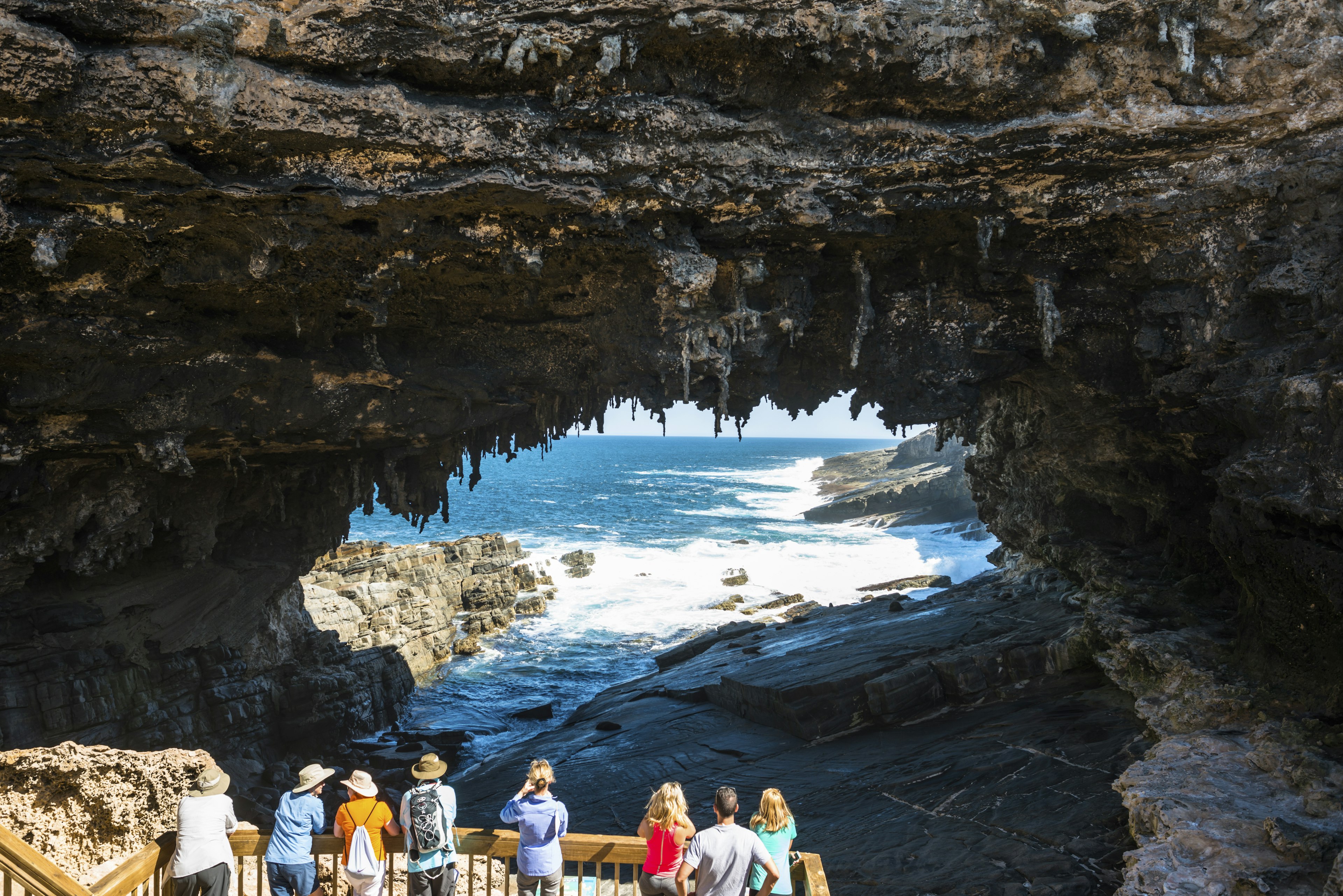 People look at Admirals Arch, Flinders Chase National Park, Kangaroo Island, Australia