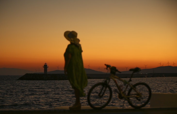 IZMIR, TURKEY - JULY 14: A woman walks near a coastline with her bicycle during sunrise in Foca district of Izmir, Turkey on July 14, 2021. (Photo by Ismail Duru/Anadolu Agency via Getty Images)
1233967343
sunrise