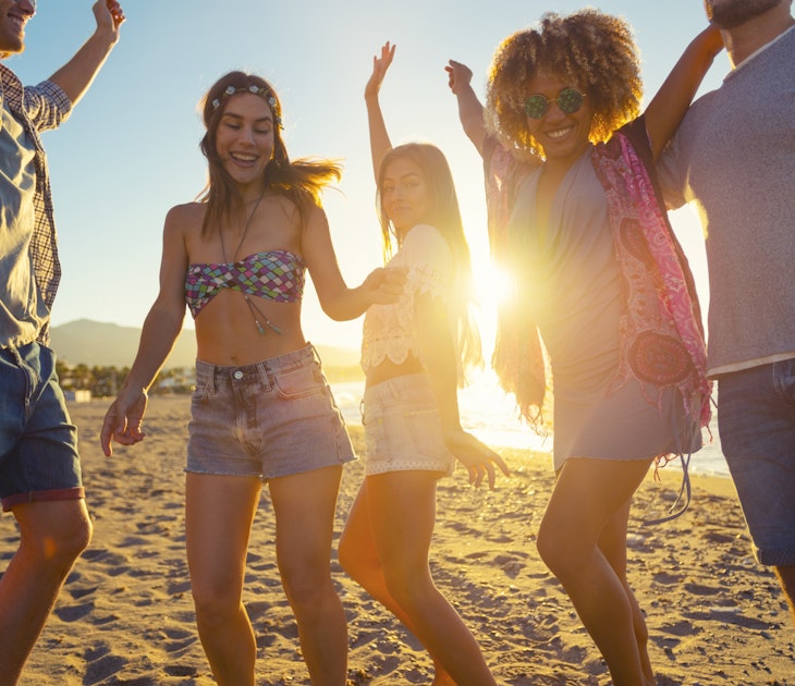 People dancing on the beach in Ibiza, Spain
