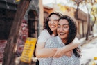 Two women embracing and smiling in Santiago de Chile