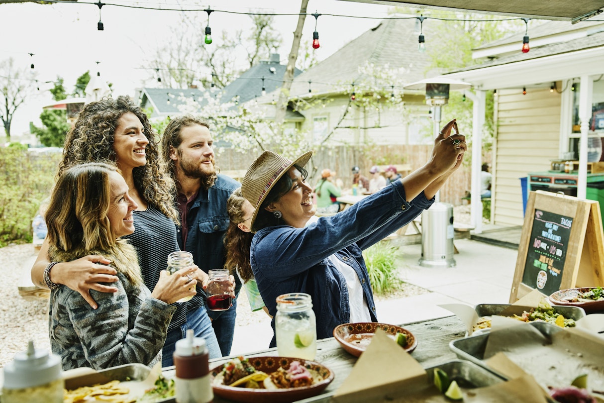1349860319
A group of friends taking a selfie next to a food truck in Colorado