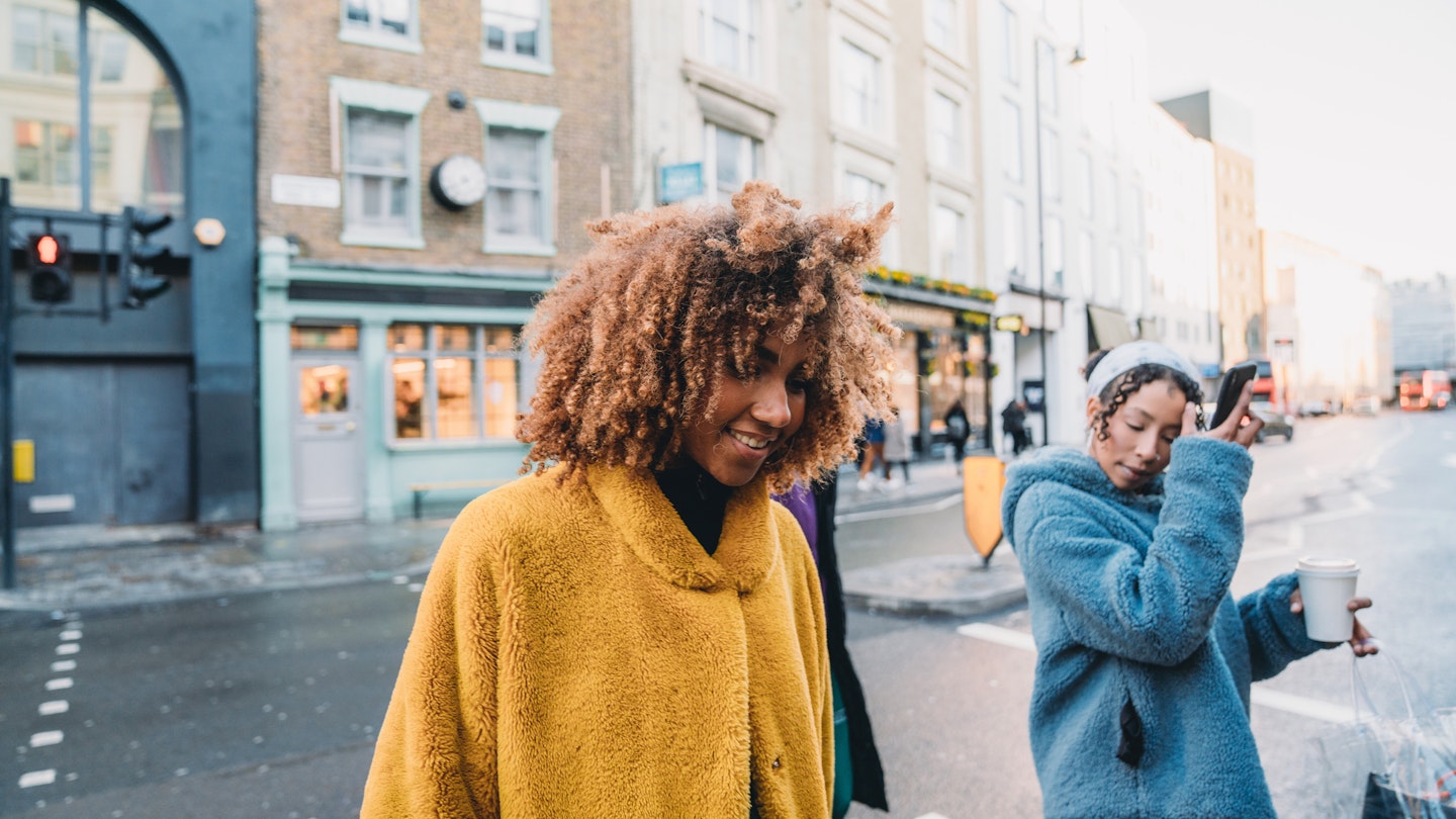 Hip friends walking in the city. They are walking in a London street. Mixed race and african ethnicities.
1355054562