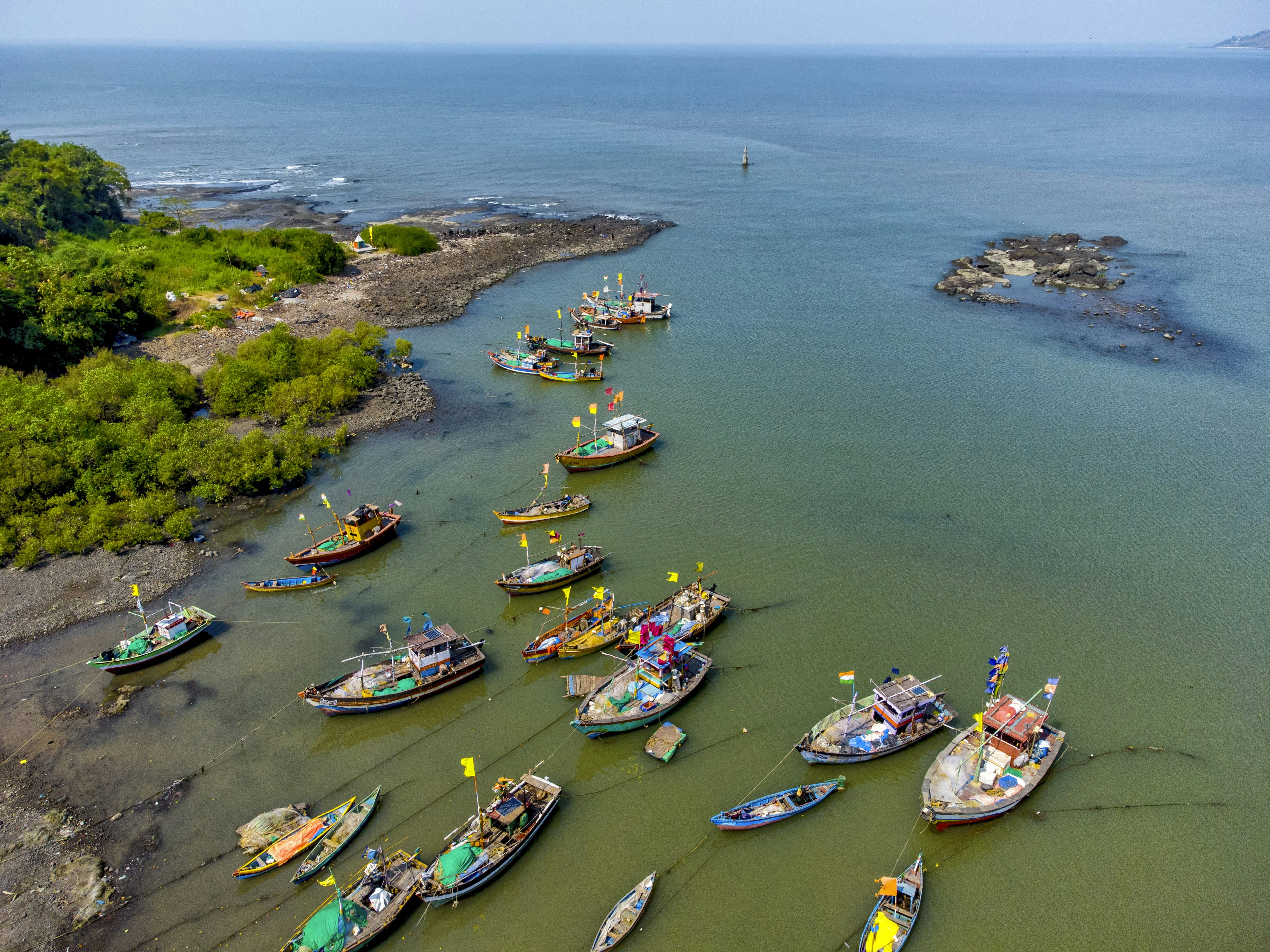 Fishing boats docked at the Tarabandar Jetty near Alibaug