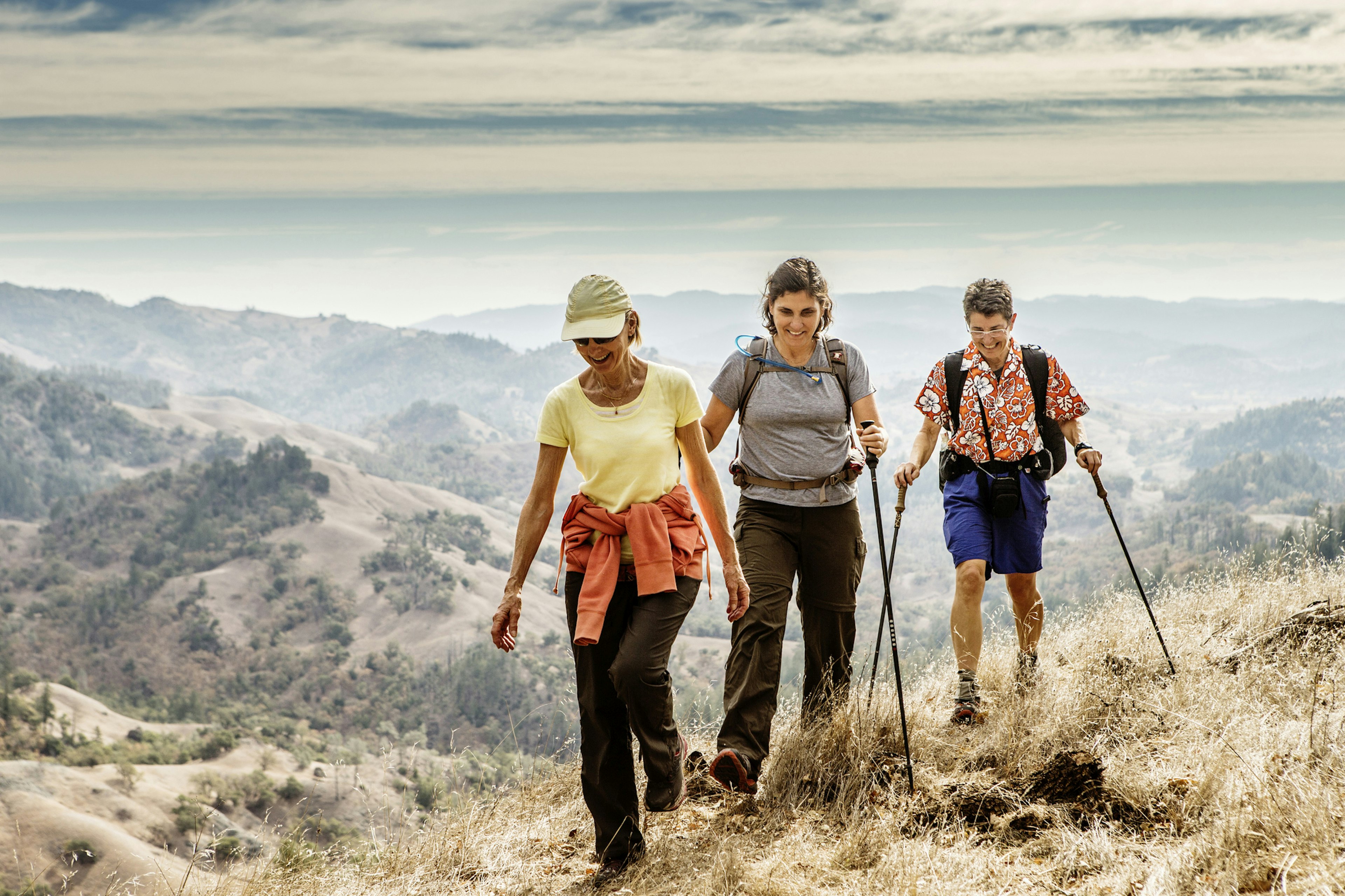 Three older women hiking in the mountains near Healdsburg, Sonoma County, California, USA