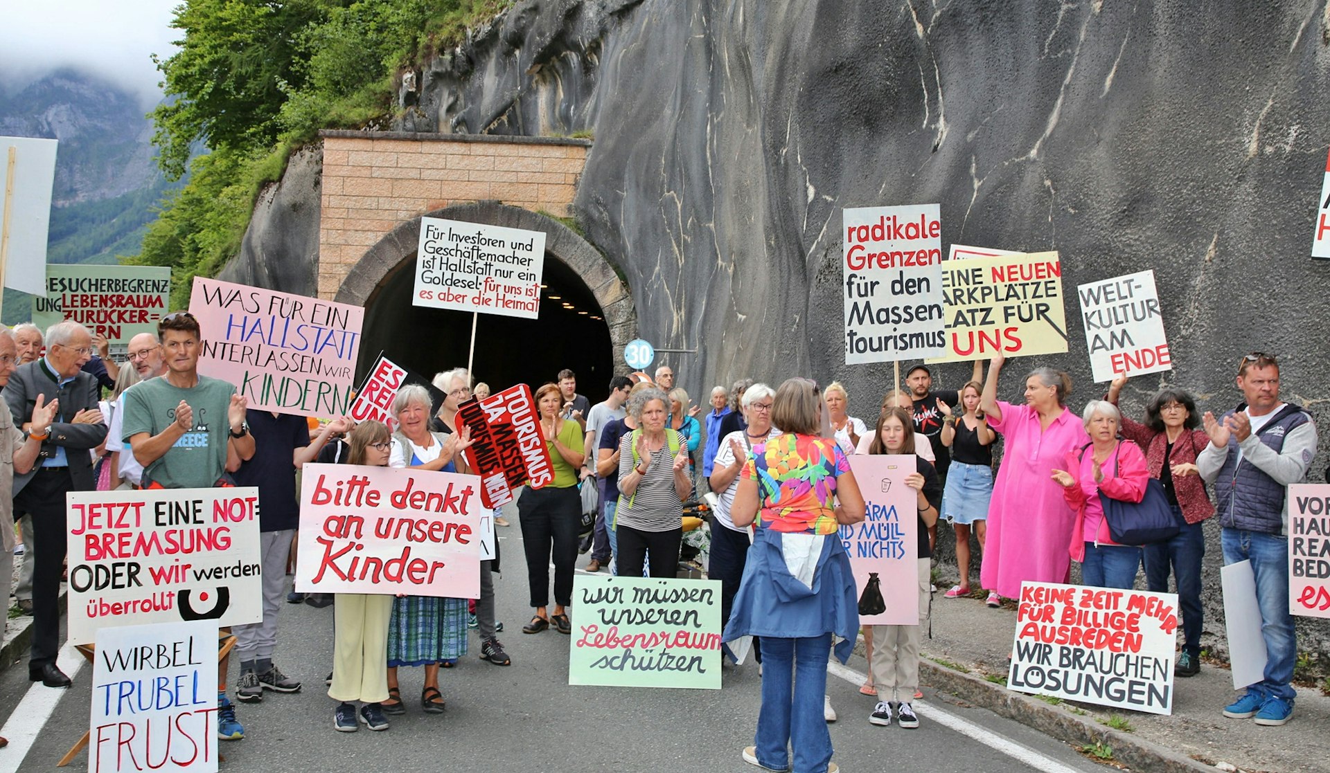 Locals protest against “overtourism” and block the road tunnel in the world-renowned sightseeing town of Hallstatt near Gmunden in Upper Austria