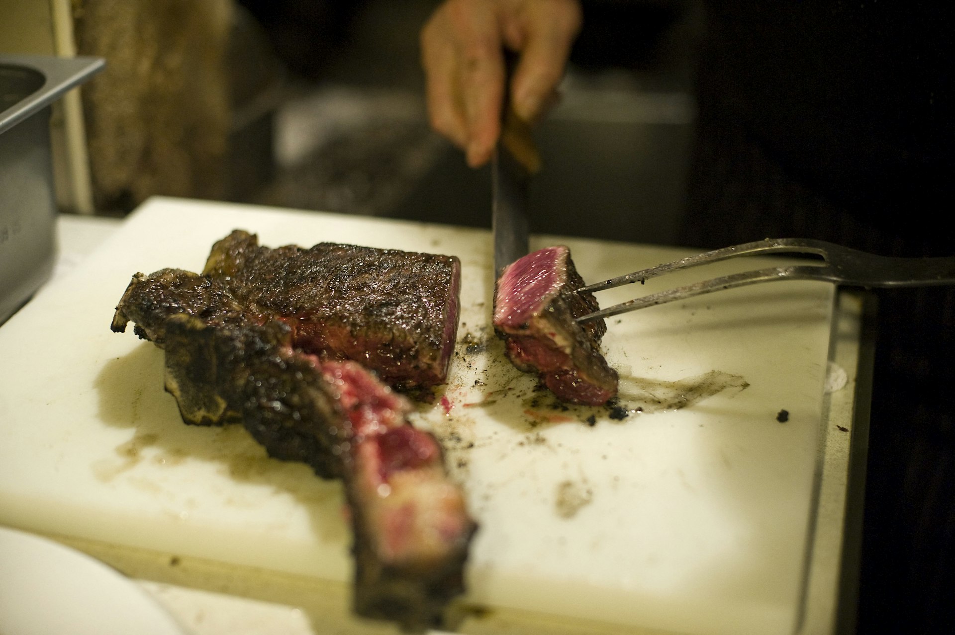 Matias Gorrotxategi, owner of the Casa Julian restaurant, cuts "txuleta" steak at his restaurant in the northern Basque city of Tolosa, Spain