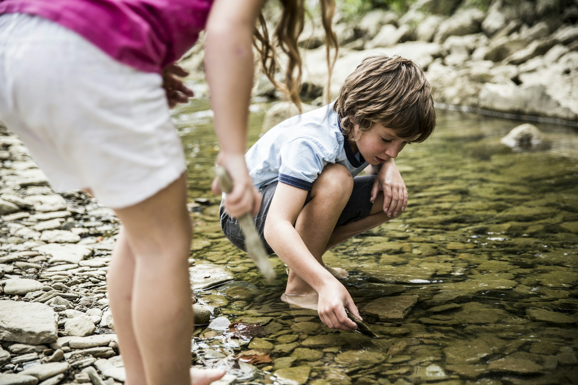 Two kids playing in a stream near Cleveland, Ohio