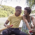 A young couple in a rowboat on a lake in Central Park, NYC