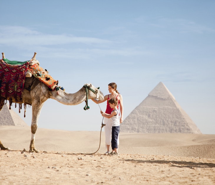 528771416
dromedary camel:CB2, mother:CB2, two people:CB1, tourist:CB3, petting:CB1, 30-34 years:CB2, mid-adult woman:CB2, young adult woman:CB2, pre-teen boy:CB2, side view:CB1, candid:CB2, copy space:CB1, Caucasian ethnicity:CB2, vacation:CB3, facial expression:CB2, desert:CB2, son:CB2, standing:CB2, 25-29 years:CB2, outdoors:CB2, 10-12 years:CB2, arid:CB2, full-length:CB2, Pyramids of Giza:CB2
Mother and son with a camel at the Pyramids of Giza, Egypt © Joshua Dalsimer / Getty Images