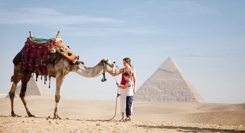 528771416
dromedary camel:CB2, mother:CB2, two people:CB1, tourist:CB3, petting:CB1, 30-34 years:CB2, mid-adult woman:CB2, young adult woman:CB2, pre-teen boy:CB2, side view:CB1, candid:CB2, copy space:CB1, Caucasian ethnicity:CB2, vacation:CB3, facial expression:CB2, desert:CB2, son:CB2, standing:CB2, 25-29 years:CB2, outdoors:CB2, 10-12 years:CB2, arid:CB2, full-length:CB2, Pyramids of Giza:CB2
Mother and son with a camel at the Pyramids of Giza, Egypt © Joshua Dalsimer / Getty Images