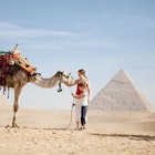 528771416
dromedary camel:CB2, mother:CB2, two people:CB1, tourist:CB3, petting:CB1, 30-34 years:CB2, mid-adult woman:CB2, young adult woman:CB2, pre-teen boy:CB2, side view:CB1, candid:CB2, copy space:CB1, Caucasian ethnicity:CB2, vacation:CB3, facial expression:CB2, desert:CB2, son:CB2, standing:CB2, 25-29 years:CB2, outdoors:CB2, 10-12 years:CB2, arid:CB2, full-length:CB2, Pyramids of Giza:CB2
Mother and son with a camel at the Pyramids of Giza, Egypt © Joshua Dalsimer / Getty Images