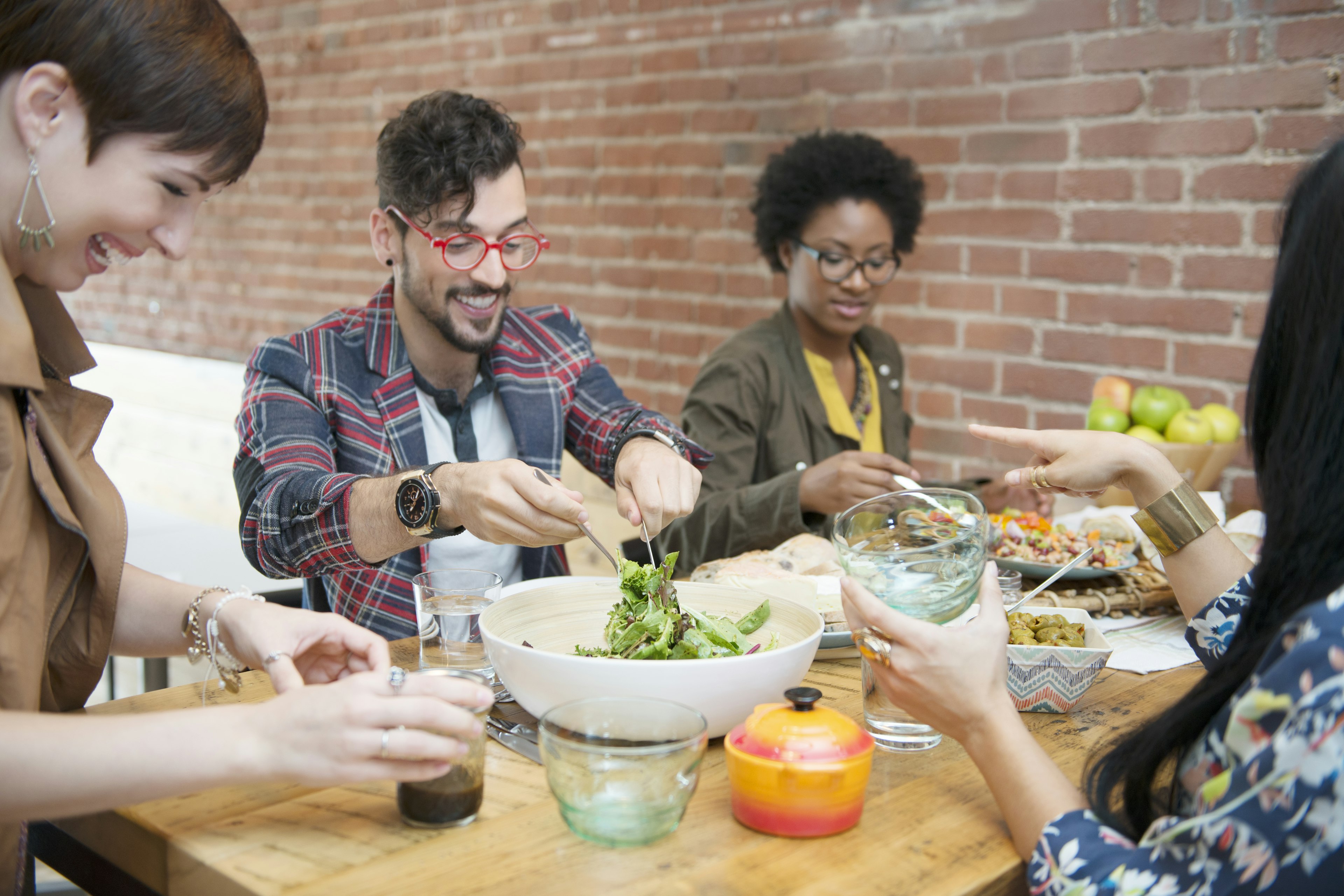 A group of friends enjoy dinner together at a restaurant in Montreal