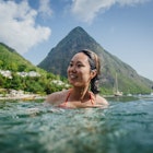 A woman enjoys the waters off Jalousie Beach, between the valley of the Pitons on the West Coast of Val des Pitons, Soufriere, St. Lucia
539976637
null
St Lucia