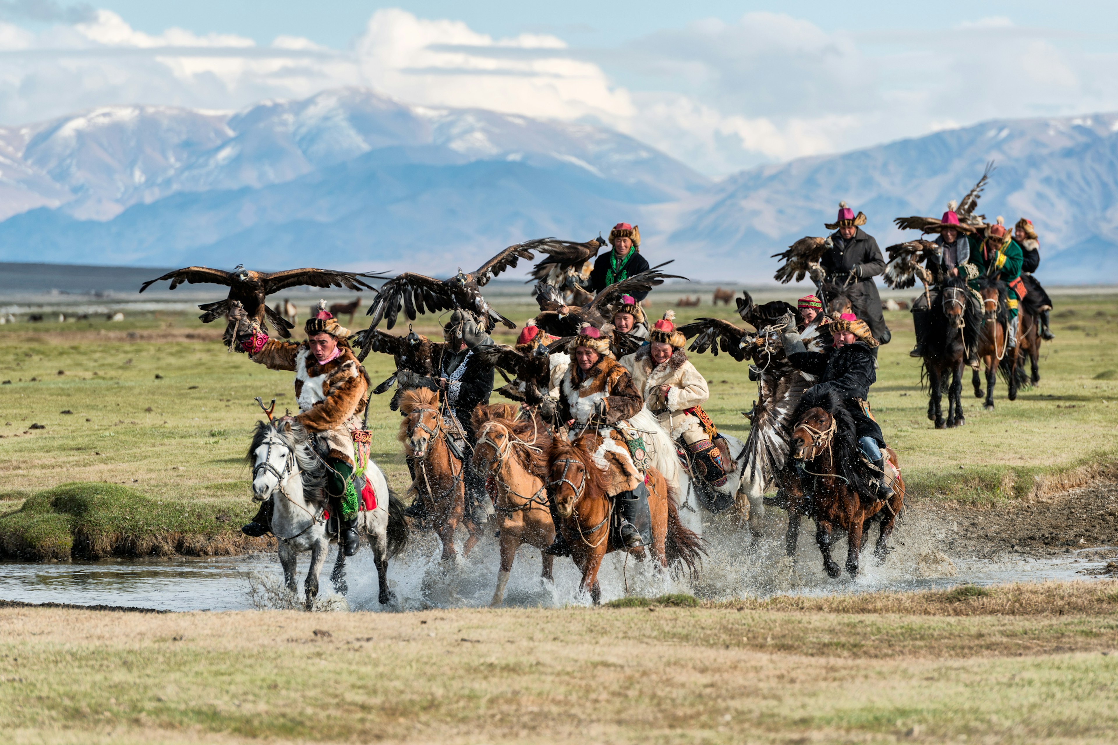 Kazakh unters with golden eagles in the Altai Mountains