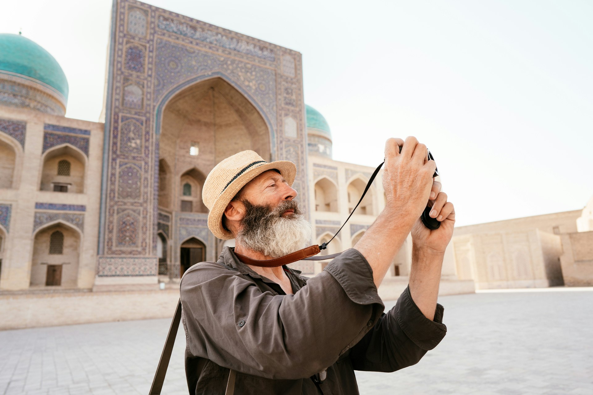 A man taking pictures of architectural structures