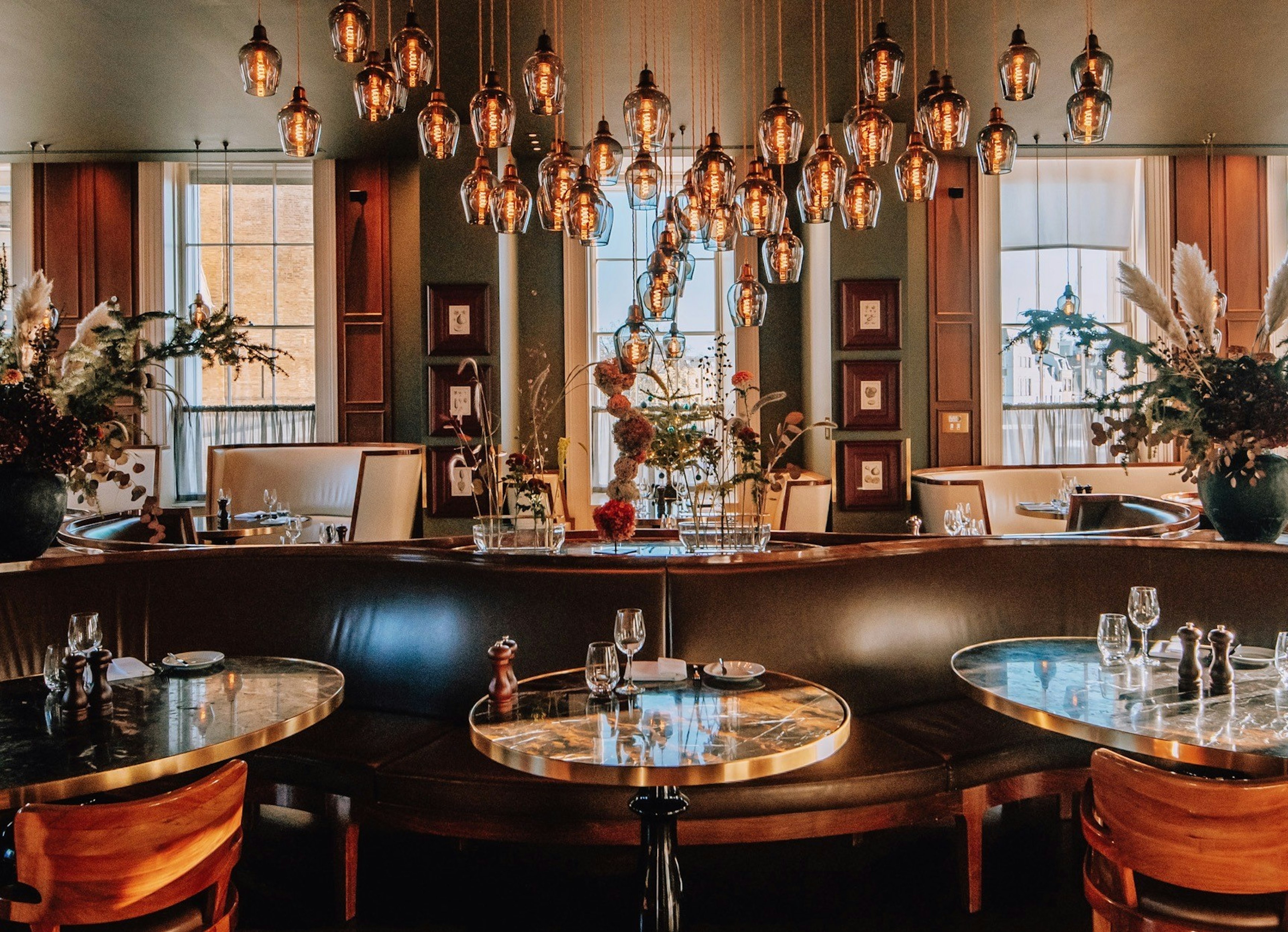 Hotel restaurant with moody lighting and swanky booths