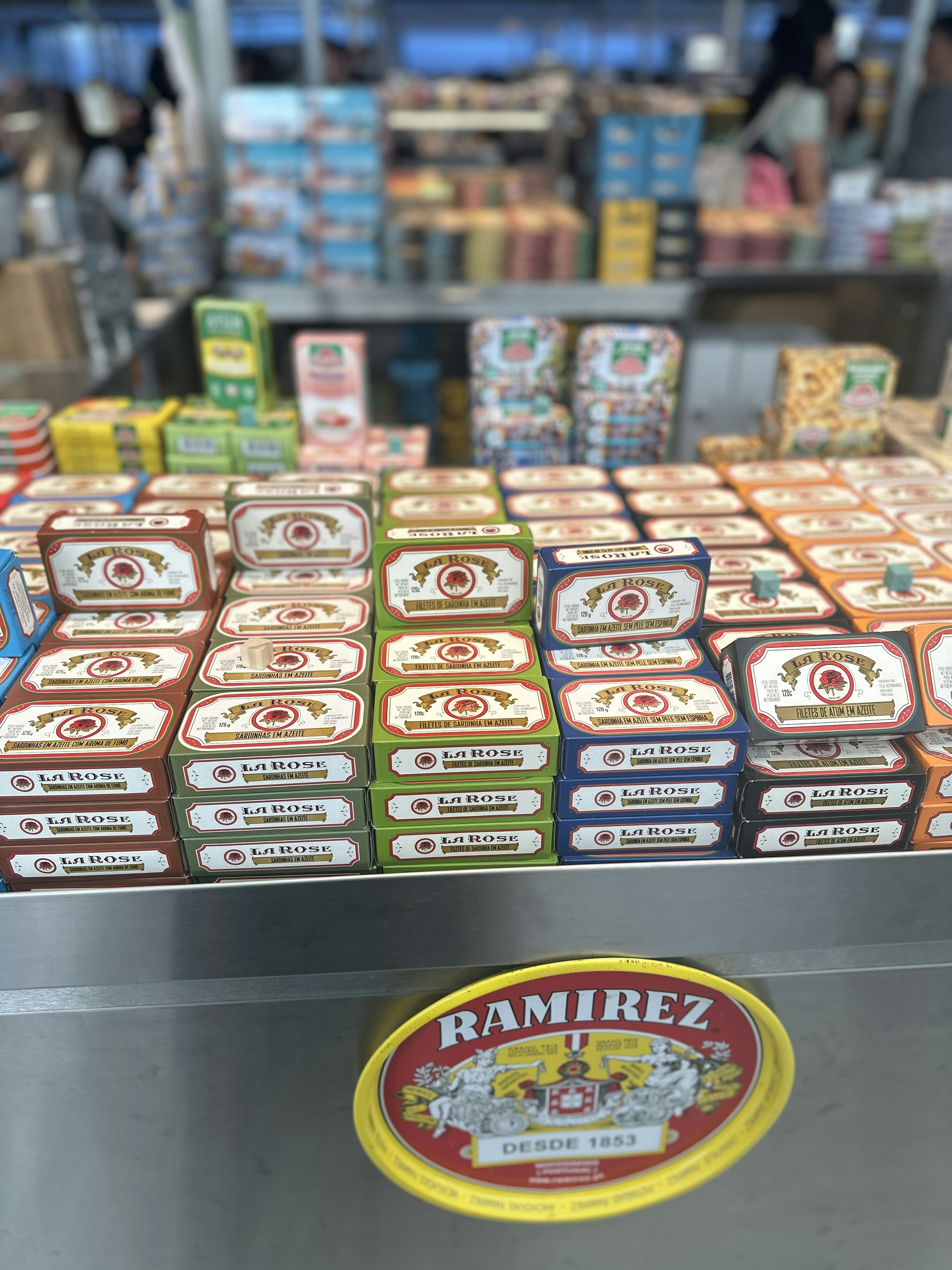 Stacks of tins of sardines on a market stall