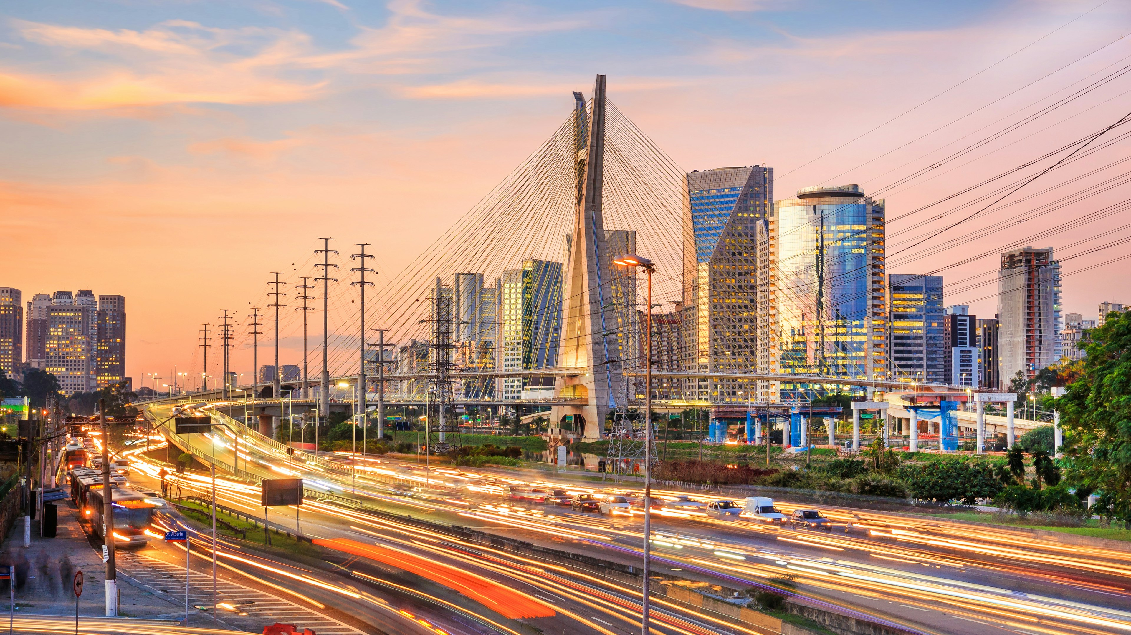 A busy bridge in a city with lots of traffic on it