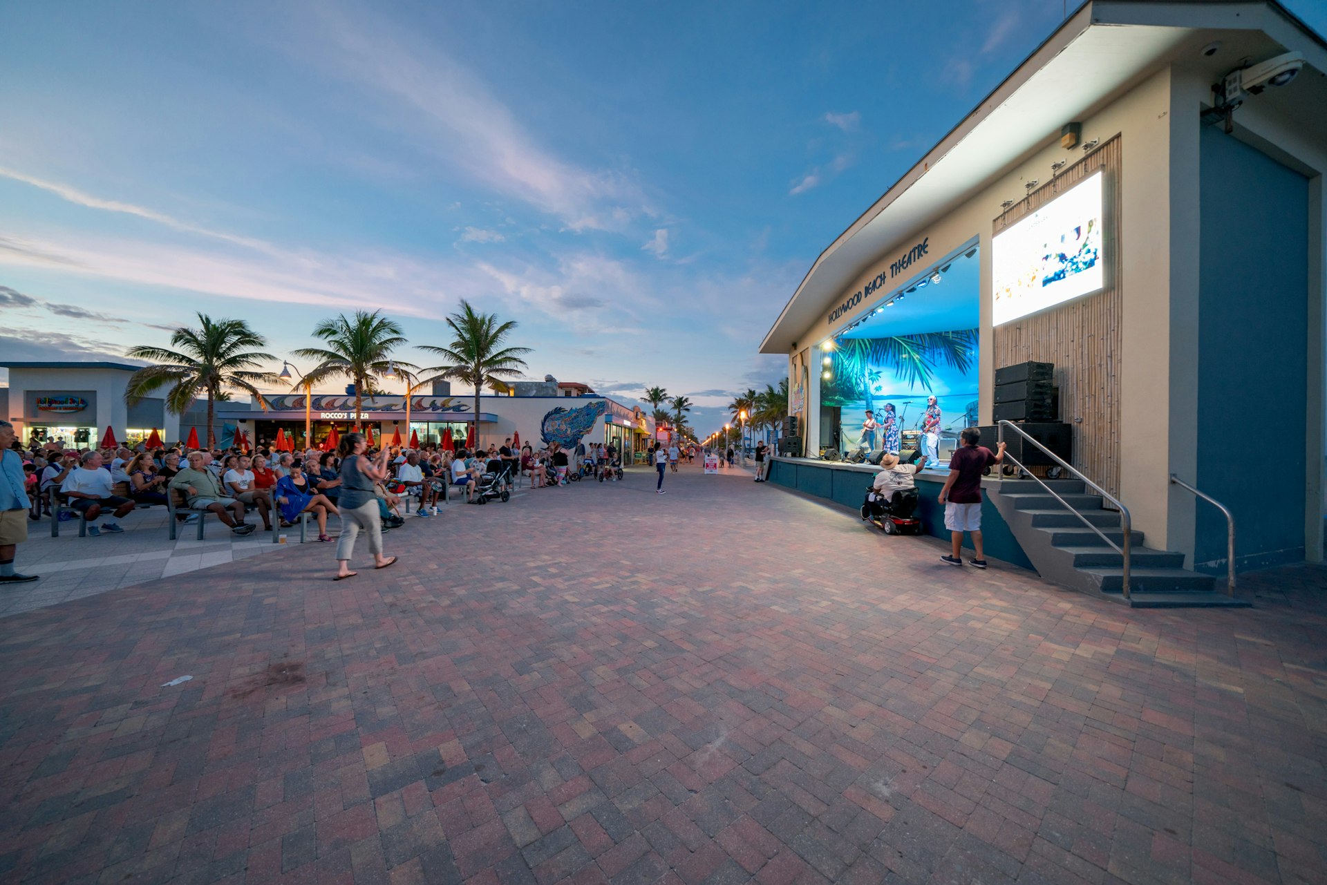 An outdoor live music venue next to the beach
