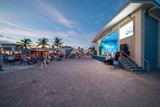 An outdoor live music venue next to the beach