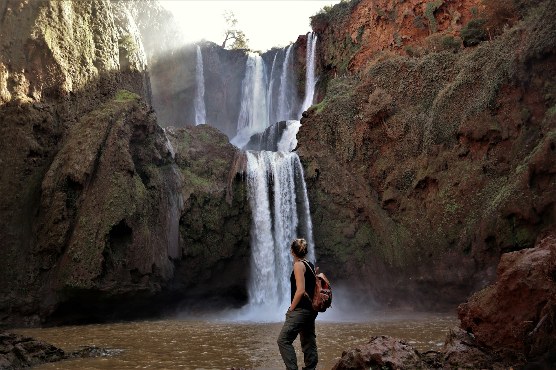 Woman admiring Ouzoud Falls in Morocco