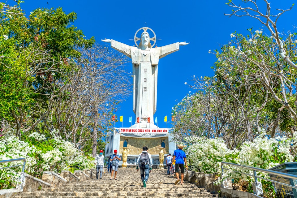 Statue of Jesus Christ standing on Mount Nho attracts pilgrims to visit.