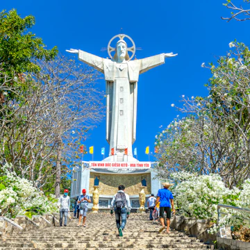 Statue of Jesus Christ standing on Mount Nho attracts pilgrims to visit.