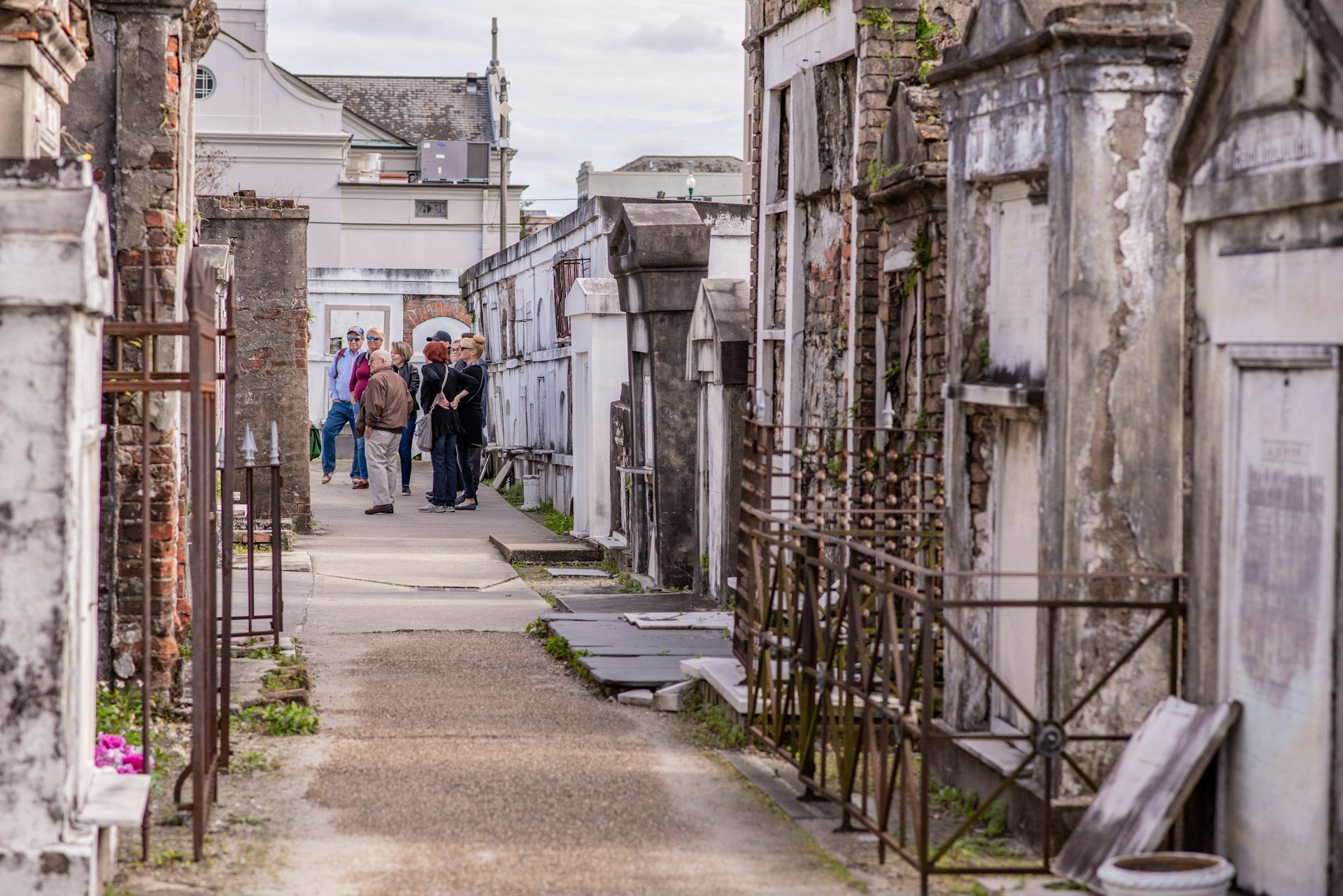 People take a guided tour of the above-ground graves in the St Louis Cemetery No 1, New Orleans, Louisiana, USA
