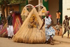 Voodoo festival in Benin. A person dressed as the spirit Zangbeto, the watcher of the night, that protects people.