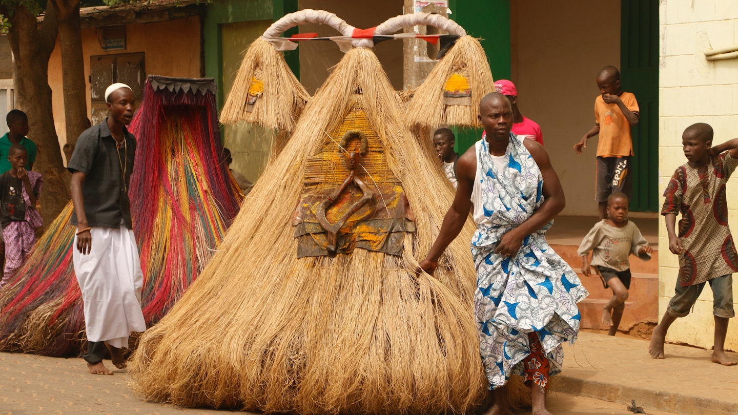 Voodoo festival in Benin. A person dressed as the spirit Zangbeto, the watcher of the night, that protects people.