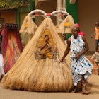Voodoo festival in Benin. A person dressed as the spirit Zangbeto, the watcher of the night, that protects people.