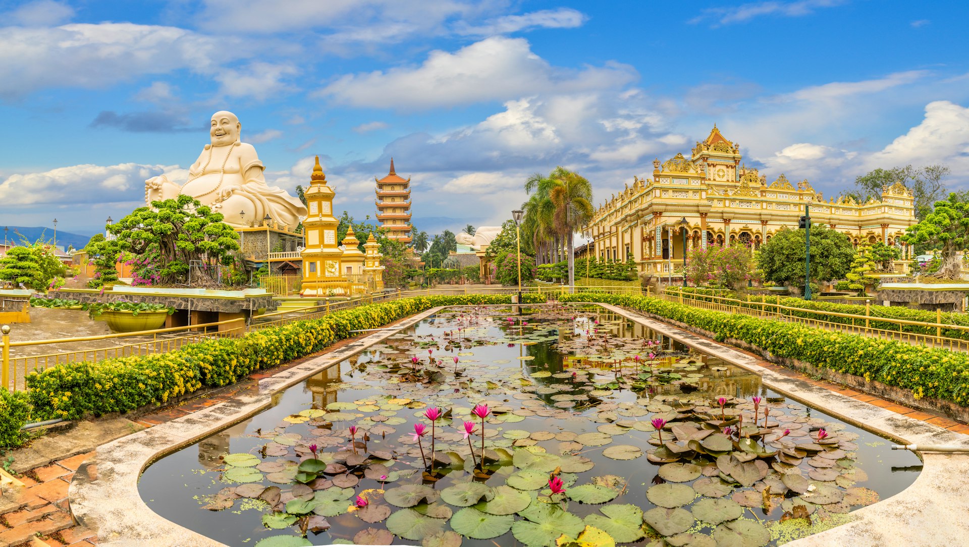 The grounds of Vinh Tranh Pagoda in My Tho, Vietnam, dominated by a giant Buddha statue. 