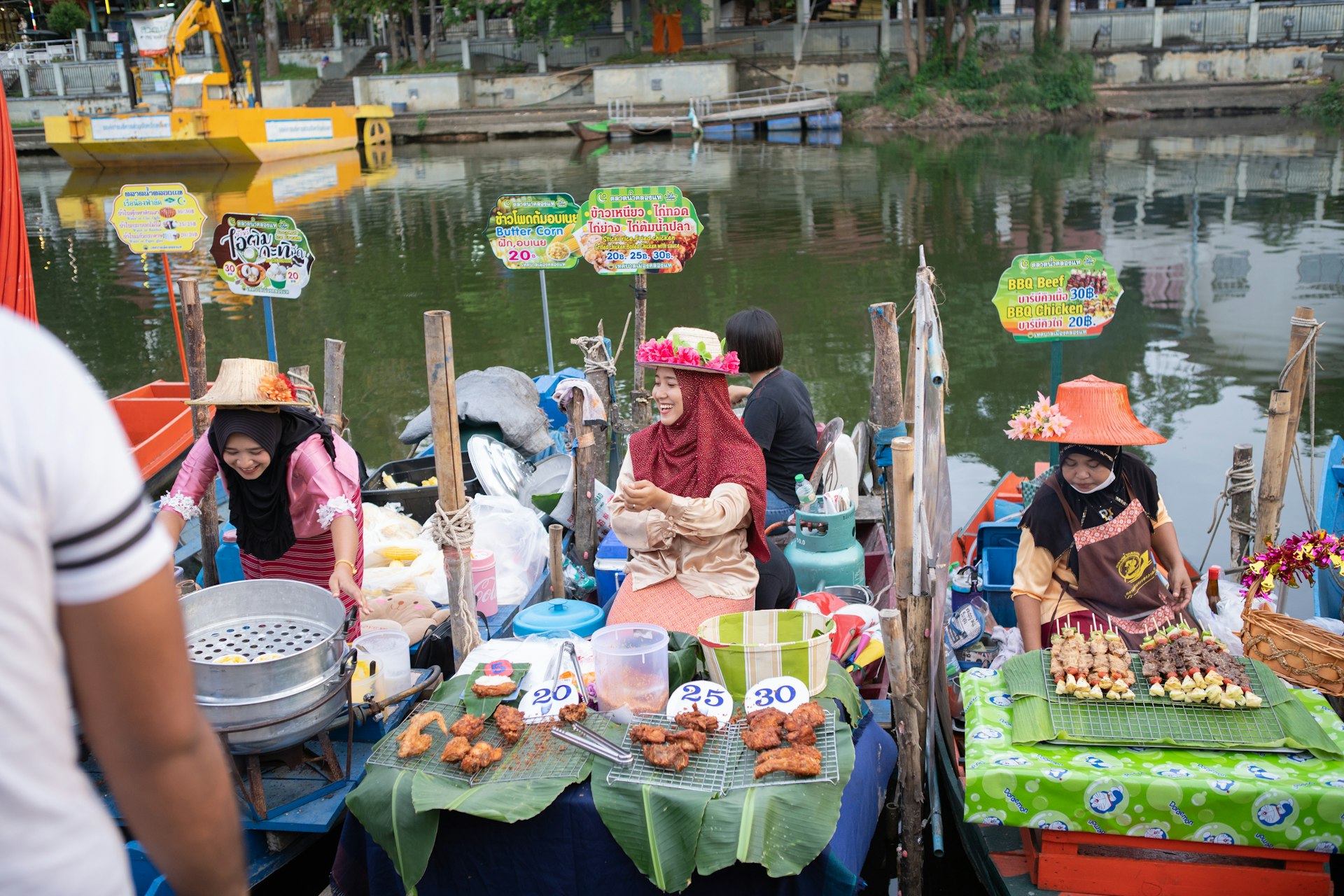 Vendors at the Khlong Hae floating market, Songkhla, Thailand