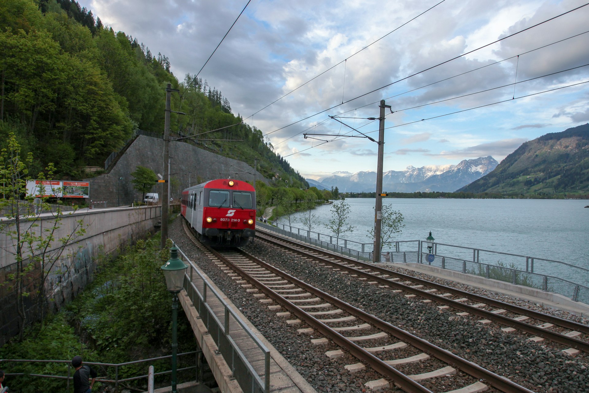 A train passes the lake in Zell am See, Austria
