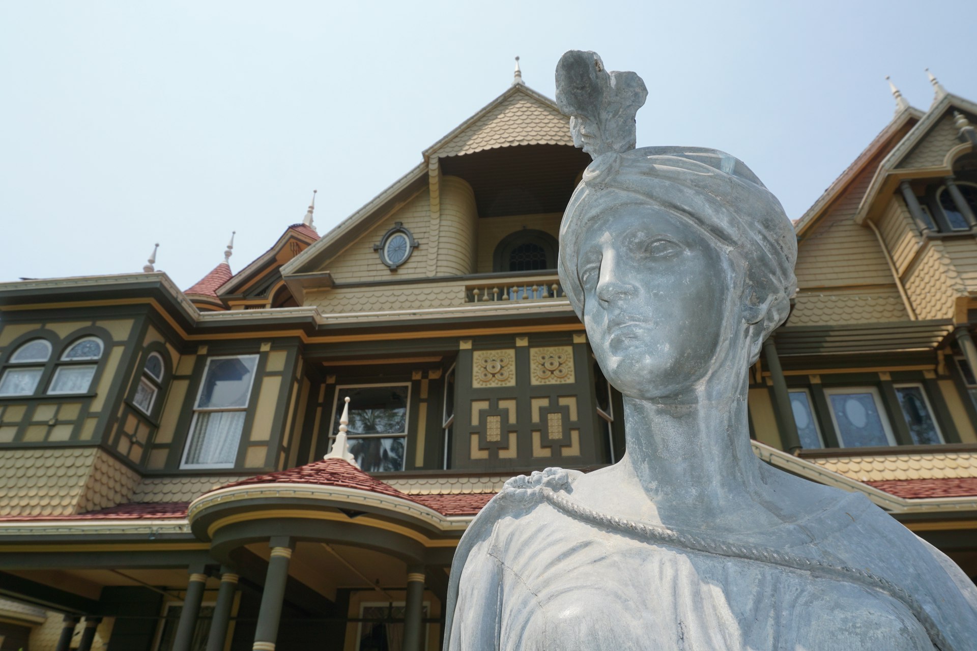 Statue in front of the Winchester House, San Jose, California, USA