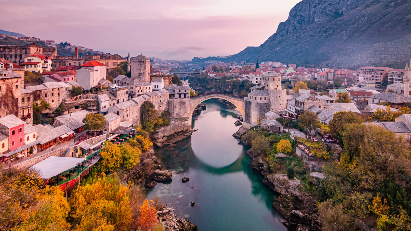 View of the historic Old Bridge in Mostar. Bosnia and Herzegovina; Shutterstock ID 1959237862; full: 65050; gl: Lonely Planet Online Editorial; netsuite: Stari Most diving; your: Brian Healy 1959237862